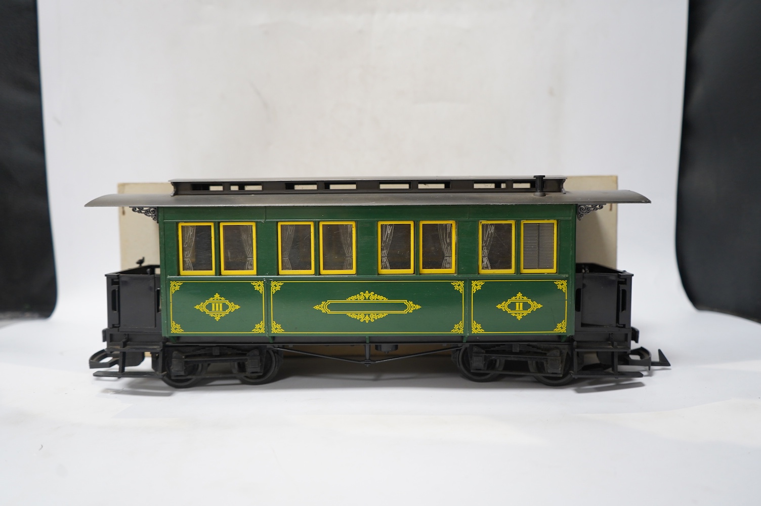 Four boxed Lehmann LGB G scale coaches; a bogie coach (3060), and three 4-wheel coaches (3106 and 2x 3050). Condition - good.